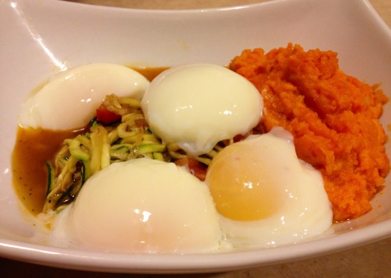 Sous Vide Eggs on top of gently cooked spiralized zucchini noodles, diced tomatoes, and yam puree. 