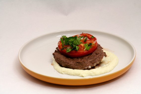 Buttered Cauliflower Puree topped with grass fed bison and Baked Tomatoes Provencal