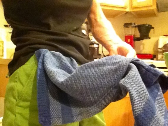 Tip #1 Kitchen towel tucked into waist band.