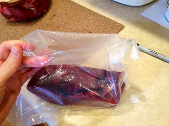 FoodSaver bag folded over on top prior to putting grass fed organic heart into it.