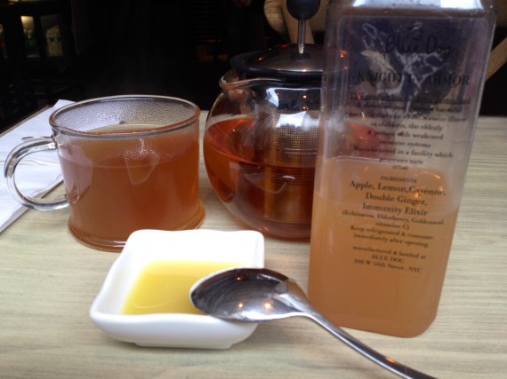 Blue Dog Cafe (NYC) herbal tea with fresh pressed ginger juice and cold pressed bottled juice.
