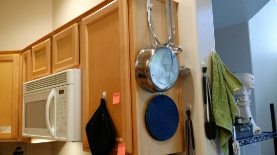 Mmmm yeah. More hooks. Pan, hot pad things, and hanging ladles from the top of cupboard. 