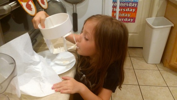 My kid licking the ice cream maker. Loving it. #GrassfedGoodness