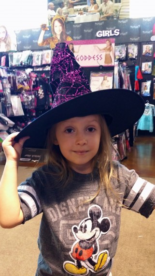 Trying on a witch hat. "I'll get you my pretty…"
